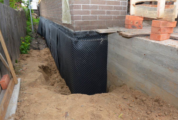 Happy homeowners after waterproofing job in Atlantic Highlands